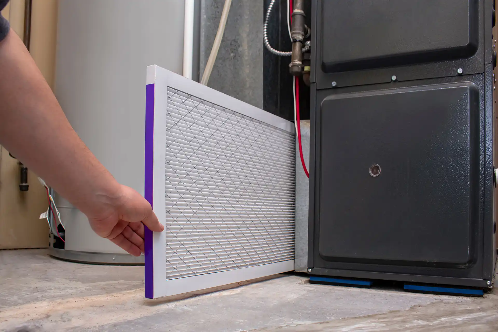 Technician Replacing Furnace Filters