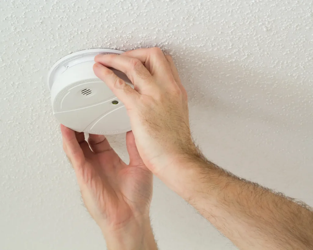 smoke detector being installed