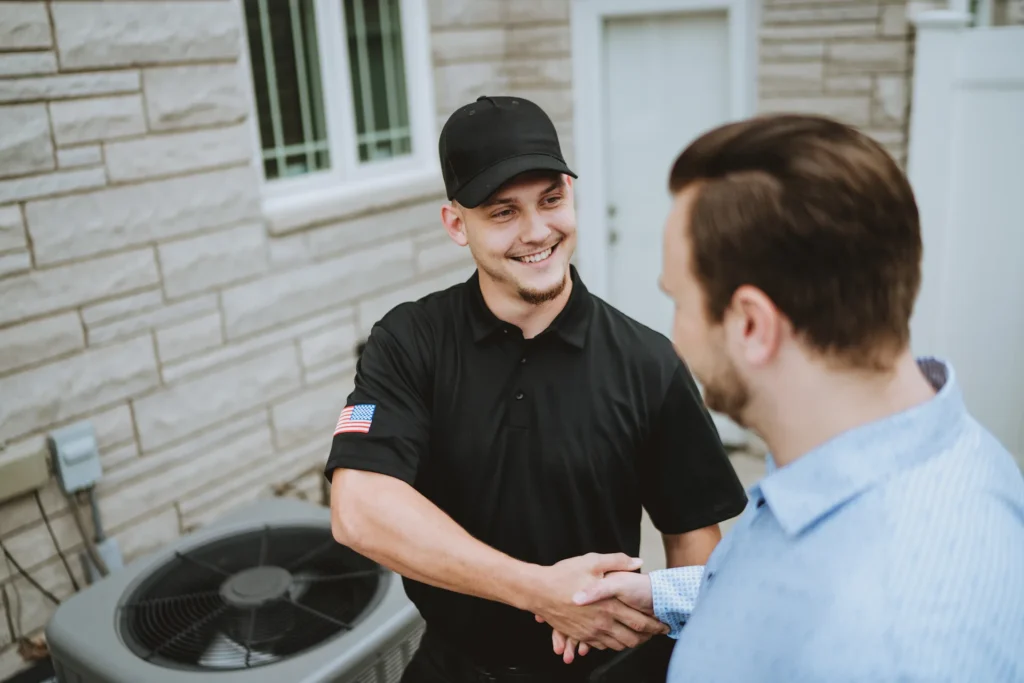 Technician shaking a customer's hand